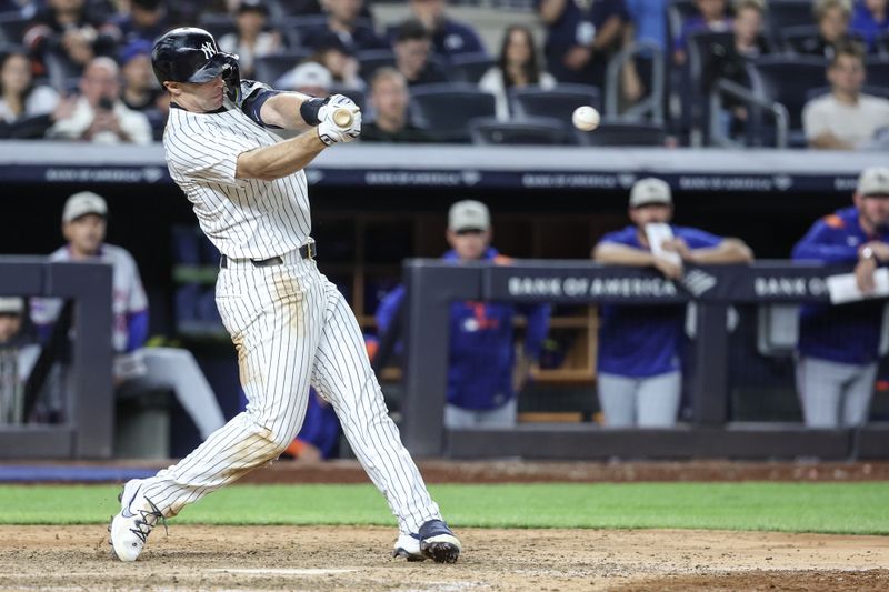 May 18, 2025; Bronx, New York, USA;  New York Yankees first baseman Paul Goldschmidt (48) hits an RBI single in the eighth inning against the New York Mets at Yankee Stadium. Mandatory Credit: Wendell Cruz-Imagn Images