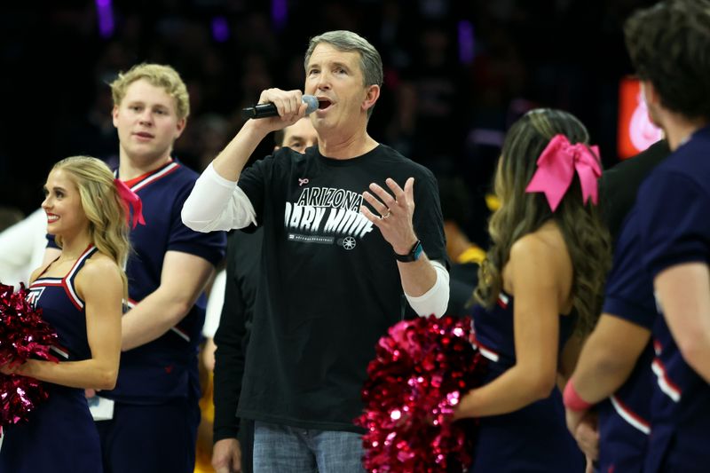 Jan 17, 2024; Tucson, Arizona, USA; Arizona Wildcats new head football coach Brett Brennan (center) gets introduced to the Arizona Wildcats crowd during the first half at McKale Center. Mandatory Credit: Zachary BonDurant-USA TODAY Sports