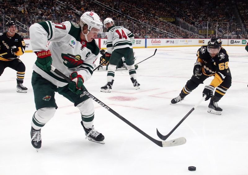 Oct 29, 2024; Pittsburgh, Pennsylvania, USA; Minnesota Wild left wing Kirill Kaprizov (97) moves the puck against the Pittsburgh Penguins during the second period at PPG Paints Arena. Mandatory Credit: Charles LeClaire-Imagn Images