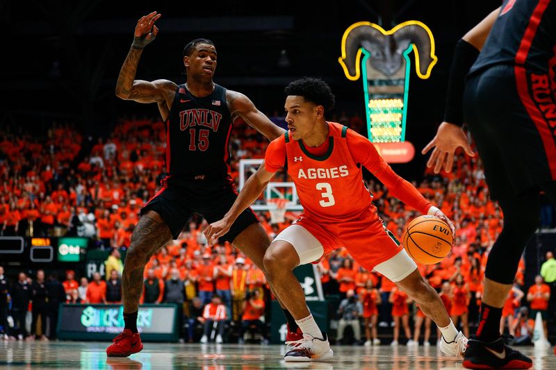 Jan 19, 2024; Fort Collins, Colorado, USA; Colorado State Rams guard Josiah Strong (3) controls the ball against UNLV Rebels guard Luis Rodriguez (15) in the second half at Moby Arena. Mandatory Credit: Isaiah J. Downing-USA TODAY Sports