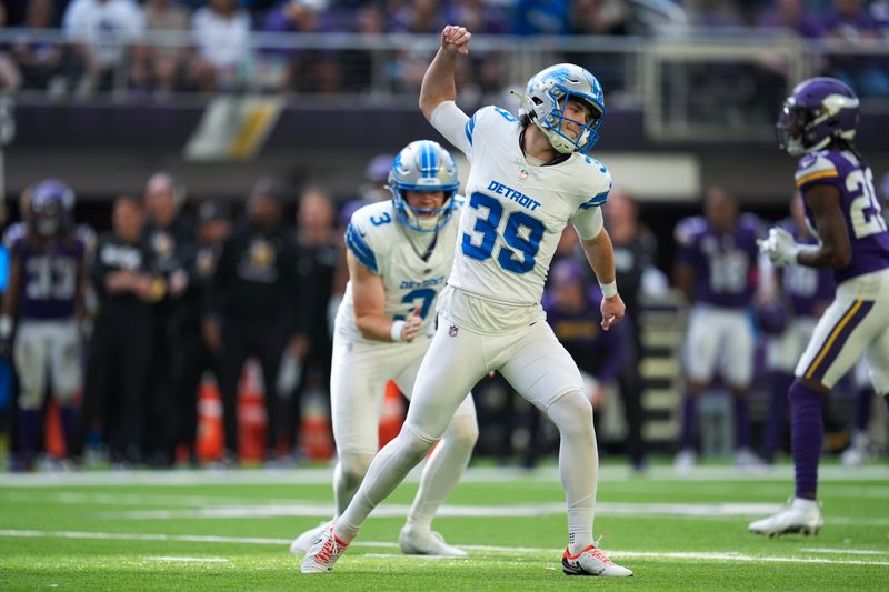 Detroit Lions place-kicker Jake Bates (39) celebrates his 44-yard field goal against the Minnesota Vikings during the second half of an NFL football game Sunday, Oct. 20, 2024, in Minneapolis. (AP Photo/Abbie Parr)