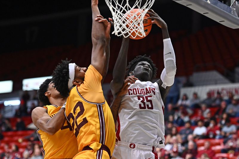 Jan 28, 2023; Pullman, Washington, USA; Washington State Cougars forward Mouhamed Gueye (35) shoots the ball against Arizona State Sun Devils forward Warren Washington (22) in the second half at Friel Court at Beasley Coliseum. Washington State won 75-58. Mandatory Credit: James Snook-USA TODAY Sports