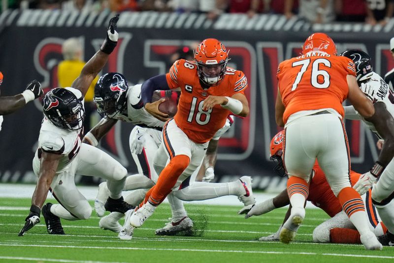 Chicago Bears quarterback Caleb Williams (18) runs with the ball during the first half of an NFL football game against the Houston Texans Sunday, Sept. 15, 2024, in Houston. (AP Photo/Eric Christian Smith)