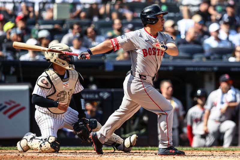 Sep 15, 2024; Bronx, New York, USA;  Boston Red Sox designated hitter Masataka Yoshida (7) hits a single in the fourth inning against the New York Yankees at Yankee Stadium. Mandatory Credit: Wendell Cruz-Imagn Images