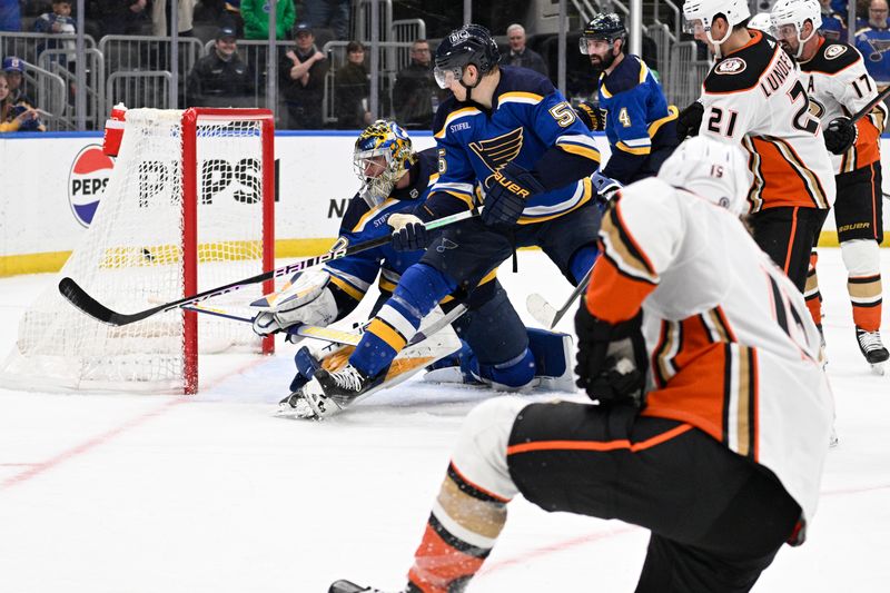 Mar 17, 2024; St. Louis, Missouri, USA; St. Louis Blues goaltender Joel Hofer (30) gives up a goal to Anaheim Ducks right wing Troy Terry (19) during the third period at Enterprise Center. Mandatory Credit: Jeff Le-USA TODAY Sports