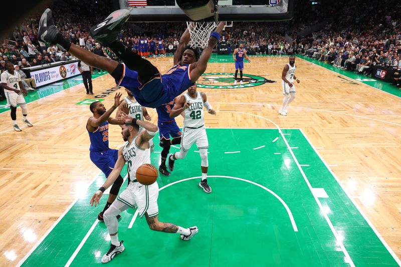 BOSTON, MASSACHUSETTS - MAY 05: OG Anunoby #8 of the New York Knicks dunks the ball against Jayson Tatum #0 of the Boston Celtics in Game One of the Eastern Conference Second Round NBA Playoffs at TD Garden on May 05, 2025 in Boston, Massachusetts. NOTE TO USER: User expressly acknowledges and agrees that, by downloading and or using this photograph, User is consenting to the terms and conditions of the Getty Images License Agreement. (Photo by Maddie Meyer/Getty Images)