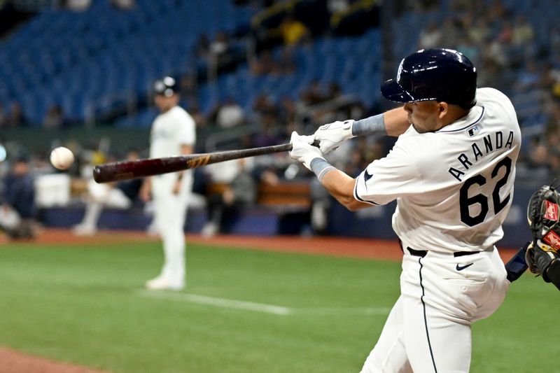 May 29, 2024; St. Petersburg, Florida, USA; Tampa Bay Rays pinch hitter Jonathan Aranda (62) hits a RBI single in the sixth inning against the Oakland Athletics at Tropicana Field. Mandatory Credit: Jonathan Dyer-USA TODAY Sports