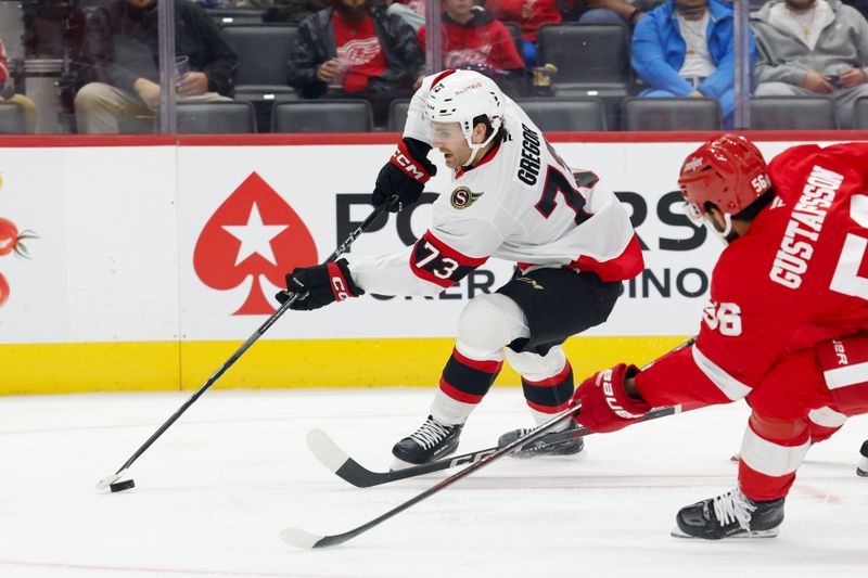 Oct 4, 2024; Detroit, Michigan, USA;  Ottawa Senators left wing Noah Gregor (73) skates with the puck while chased by Detroit Red Wings defenseman Erik Gustafsson (56) in the first period at Little Caesars Arena. Mandatory Credit: Rick Osentoski-Imagn Images