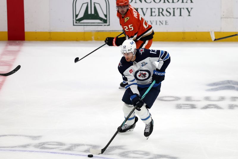 Nov 9, 2025; Anaheim, California, USA;  Winnipeg Jets center Gabriel Vilardi (13) skates with the puck during the third period against the Anaheim Ducks at Honda Center. Mandatory Credit: Kiyoshi Mio-Imagn Images