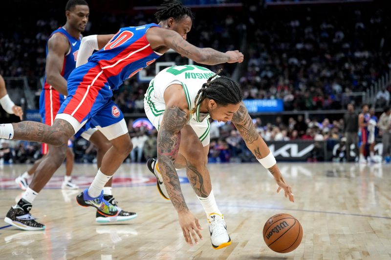 DETROIT, MICHIGAN - FEBRUARY 26: JD Davison #20 of the Boston Celtics goes for the ball against Ronald Holland II #00 of the Detroit Pistons during the fourth quarter at Little Caesars Arena on February 26, 2025 in Detroit, Michigan. NOTE TO USER: User expressly acknowledges and agrees that, by downloading and or using this photograph, User is consenting to the terms and conditions of the Getty Images License Agreement. (Photo by Nic Antaya/Getty Images)