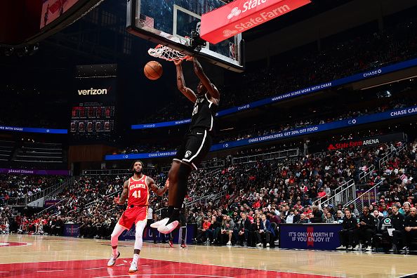 ATLANTA, GA - DECEMBER 6: Day'Ron Sharpe #20 of the Brooklyn Nets dunks the ball during the game against the Atlanta Hawks on December 6, 2023 at State Farm Arena in Atlanta, Georgia.  NOTE TO USER: User expressly acknowledges and agrees that, by downloading and/or using this Photograph, user is consenting to the terms and conditions of the Getty Images License Agreement. Mandatory Copyright Notice: Copyright 2023 NBAE (Photo by Scott Cunningham/NBAE via Getty Images)