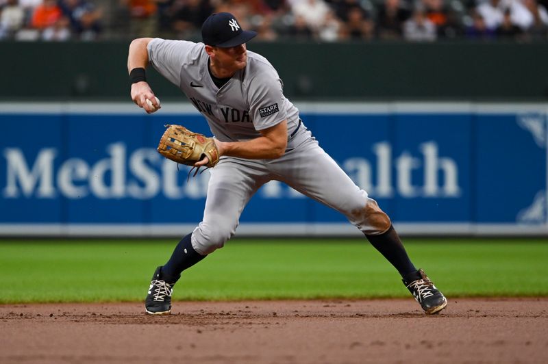 Jul 12, 2024; Baltimore, Maryland, USA; New York Yankees third baseman DJ LeMahieu (26) twos to first base during the first inning against the Baltimore Orioles  at Oriole Park at Camden Yards. Mandatory Credit: Tommy Gilligan-USA TODAY Sports