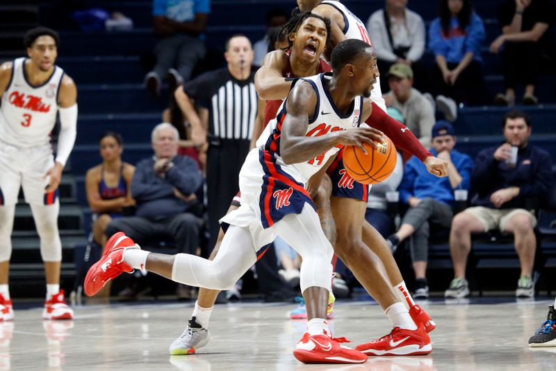 Feb 11, 2023; Oxford, Mississippi, USA; Mississippi Rebels guard Tye Fagan (14) dribbles as South Carolina Gamecocks guard Meechie Johnson (5) defends during the first half at The Sandy and John Black Pavilion at Ole Miss. Mandatory Credit: Petre Thomas-USA TODAY Sports