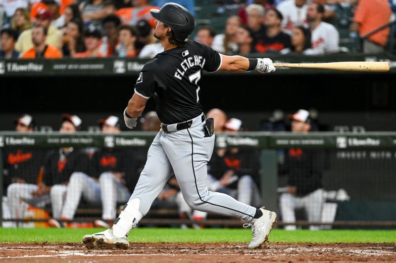 Sep 4, 2024; Baltimore, Maryland, USA;  Chicago White Sox outfielder Dominic Fletcher (7) swings through a fourth inning two run home run against the Baltimore Orioles at Oriole Park at Camden Yards. Mandatory Credit: Tommy Gilligan -Imagn Images