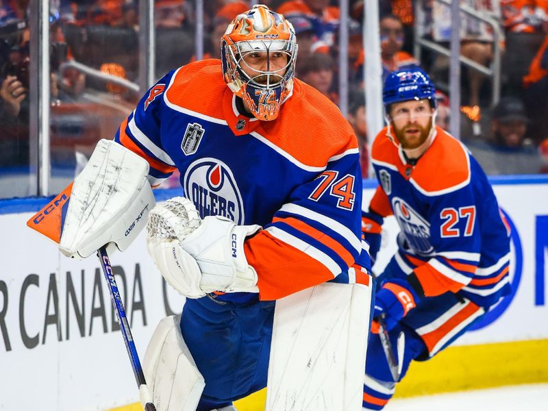 Jun 21, 2024; Edmonton, Alberta, CAN; Edmonton Oilers goaltender Stuart Skinner (74) controls the puck against the Florida Panthers during the first period in game six of the 2024 Stanley Cup Final at Rogers Place. Mandatory Credit: Sergei Belski-USA TODAY Sports