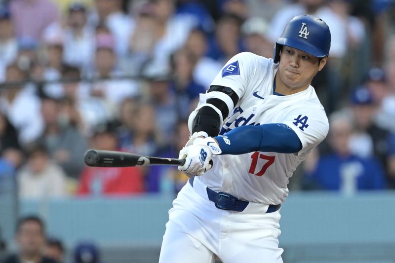 Jun 13, 2024; Los Angeles, California, USA;  Los Angeles Dodgers designated hitter Shohei Ohtani (17) grounds out in the first inning against the Texas Rangers at Dodger Stadium. Mandatory Credit: Jayne Kamin-Oncea-USA TODAY Sports