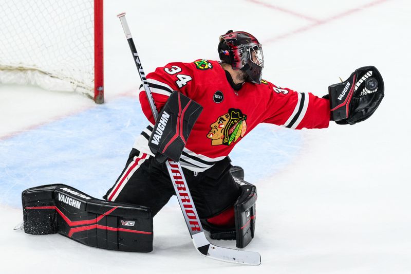 Feb 9, 2024; Chicago, Illinois, USA; Chicago Blackhawks goaltender Petr Mrazek (34) makes a save against the New York Rangers during overtime at the United Center. Mandatory Credit: Daniel Bartel-USA TODAY Sports