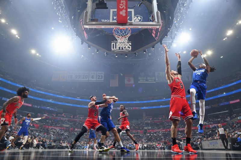 LOS ANGELES, CA - MARCH 9: Terance Mann #14 of the LA Clippers shoots the ball during the game against the Chicago Bulls on March 9, 2024 at Crypto.Com Arena in Los Angeles, California. NOTE TO USER: User expressly acknowledges and agrees that, by downloading and/or using this Photograph, user is consenting to the terms and conditions of the Getty Images License Agreement. Mandatory Copyright Notice: Copyright 2024 NBAE (Photo by Adam Pantozzi/NBAE via Getty Images)