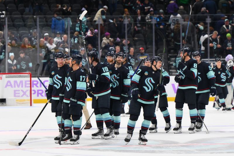 Nov 16, 2023; Seattle, Washington, USA; The Seattle Kraken celebrate after defeating the New York Islanders in a shootout at Climate Pledge Arena. Mandatory Credit: Steven Bisig-USA TODAY Sports