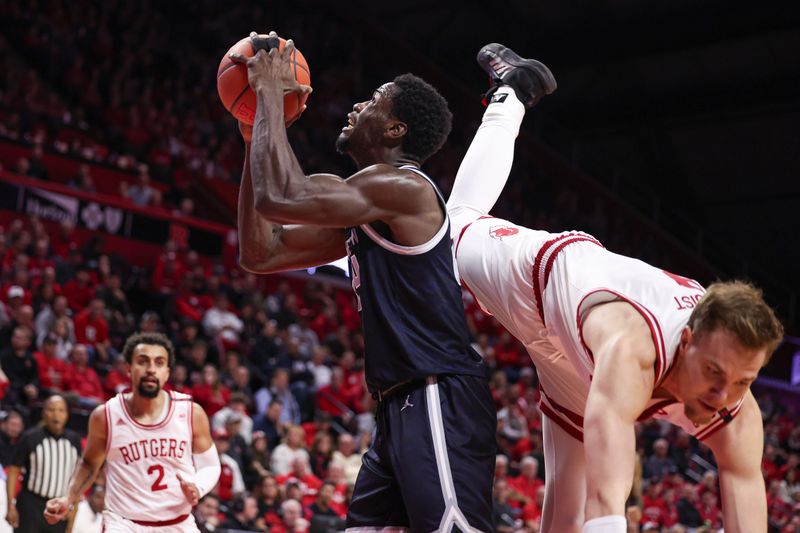 Nov 15, 2023; Piscataway, New Jersey, USA; Georgetown Hoyas forward Supreme Cook (24) looks to shoot as Rutgers Scarlet Knights forward Oskar Palmquist (9) defends in front of guard Noah Fernandes (2) during the first half at Jersey Mike's Arena. Mandatory Credit: Vincent Carchietta-USA TODAY Sports