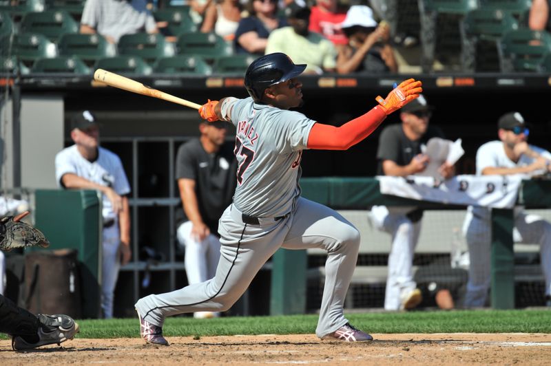 Aug 25, 2024; Chicago, Illinois, USA; Detroit Tigers second base Andy Ibanez (77) hits a two-run home run during the seventh inning against the Chicago White Sox at Guaranteed Rate Field. Mandatory Credit: Patrick Gorski-USA TODAY Sports