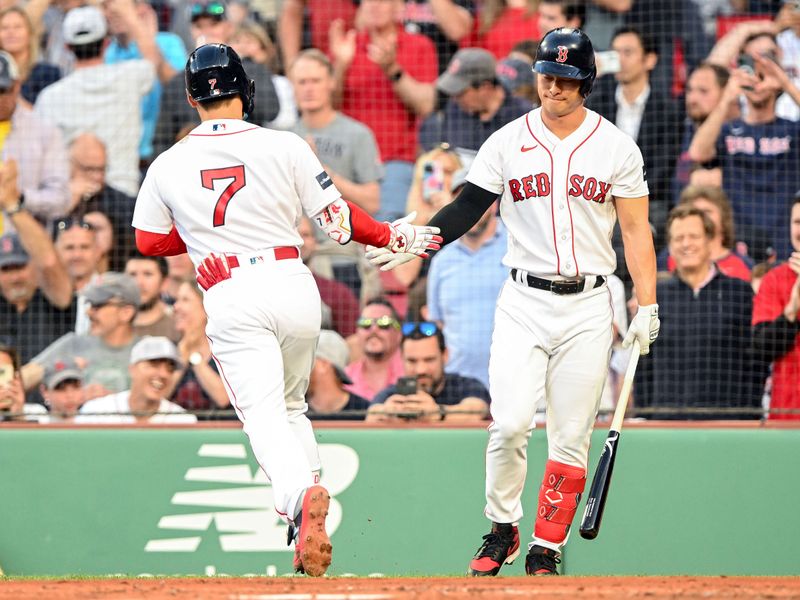 May 31, 2023; Boston, Massachusetts, USA; Boston Red Sox left fielder Masataka Yoshida (7) celebrates with left fielder Rob Refsnyder (30) after hitting a solo home run against the Cincinnati Reds during the second inning at Fenway Park. Mandatory Credit: Brian Fluharty-USA TODAY Sports