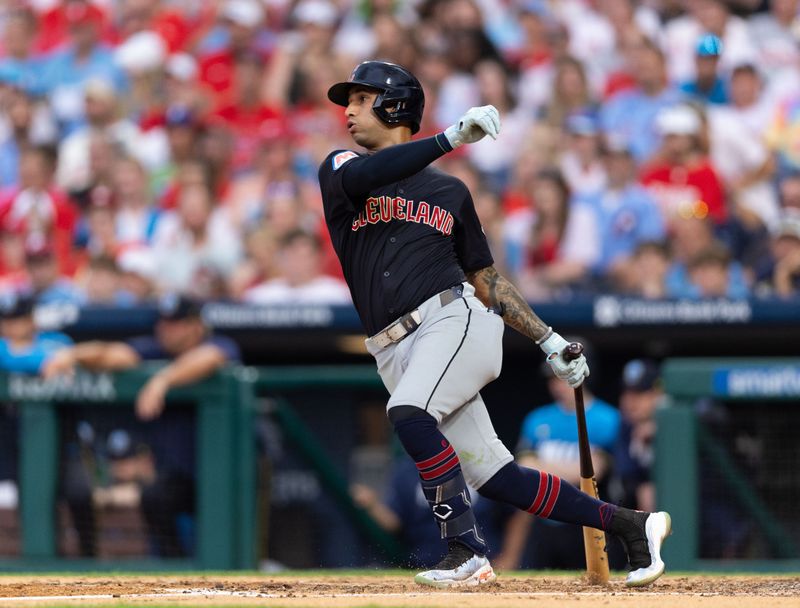 Jul 26, 2024; Philadelphia, Pennsylvania, USA; Cleveland Guardians shortstop Brayan Rocchio (4) hits a single during the fourth inning against the Philadelphia Phillies at Citizens Bank Park. Mandatory Credit: Bill Streicher-USA TODAY Sports