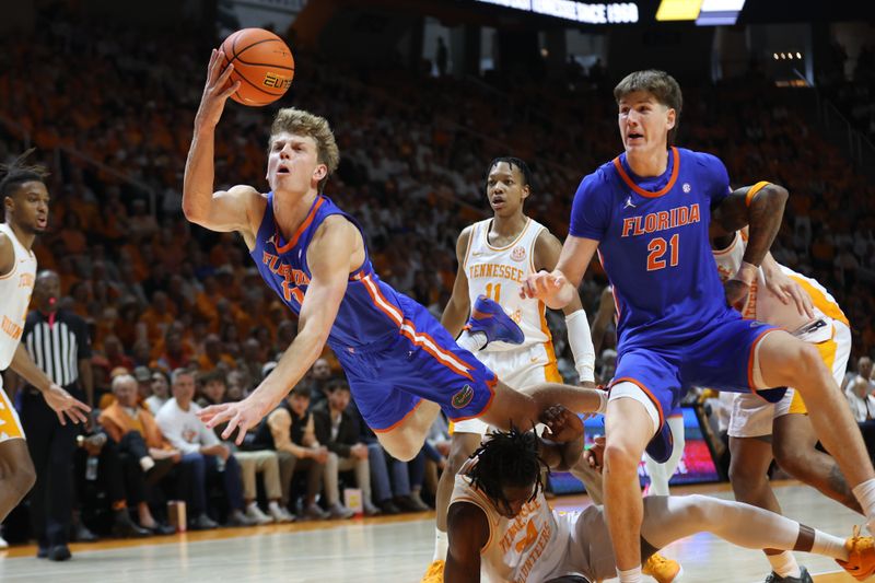 Feb 1, 2025; Knoxville, Tennessee, USA; Florida Gators forward Thomas Haugh (10) tries to keep a ball inbounds during the second half against the Tennessee Volunteers at Thompson-Boling Arena at Food City Center. Mandatory Credit: Randy Sartin-Imagn Images