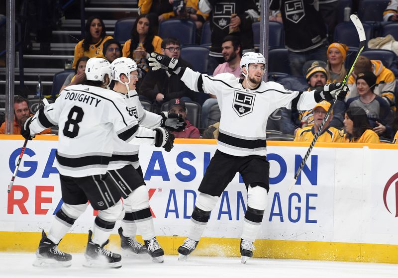 Jan 21, 2023; Nashville, Tennessee, USA; Los Angeles Kings right wing Adrian Kempe (9) celebrates with teammates after a goal during the second period against the Nashville Predators at Bridgestone Arena. Mandatory Credit: Christopher Hanewinckel-USA TODAY Sports