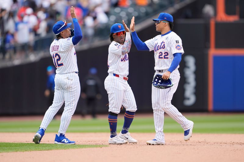 Jun 1, 2025; New York City, New York, USA;  New York Mets shortstop Francisco Lindor (12), second baseman Luisangel Acuna (2) and right fielder Juan Soto (22) celebrate the victory against the Colorado Rockies after the ninth inning at Citi Field. Mandatory Credit: Gregory Fisher-Imagn Images