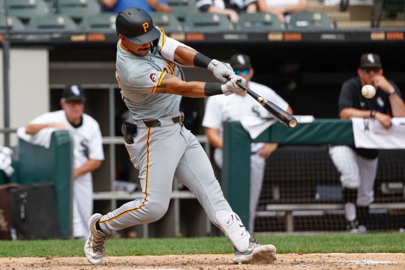 Jul 14, 2024; Chicago, Illinois, USA; Pittsburgh Pirates second baseman Nick Gonzales (39) hits a two-run triple against the Chicago White Sox during the seventh inning at Guaranteed Rate Field. Mandatory Credit: Kamil Krzaczynski-USA TODAY Sports