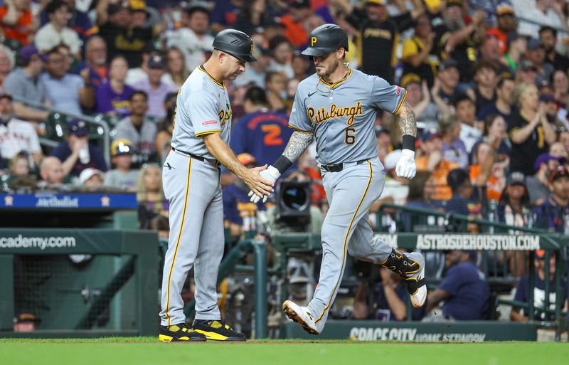 Jul 29, 2024; Houston, Texas, USA; Pittsburgh Pirates catcher Yasmani Grandal (6) celebrates with third base coach and field coordinator Mike Rabelo (58) after hitting a home run during the sixth inning against the Houston Astros at Minute Maid Park. Mandatory Credit: Troy Taormina-USA TODAY Sports
