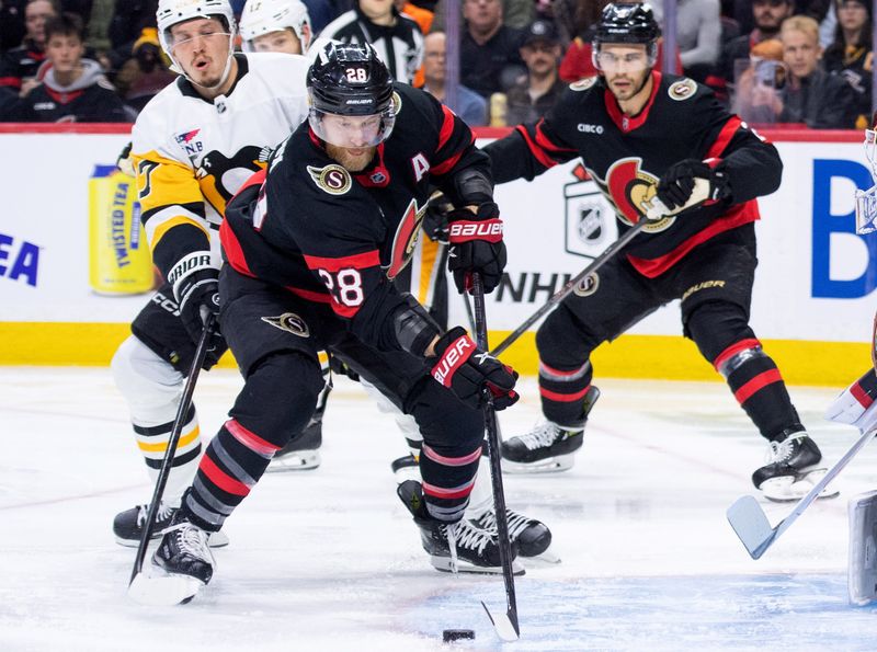 Dec 18, 2025; Ottawa, Ontario, CAN; Ottawa Senators right wing Claude Giroux (28) controls the puck in front of Pittsburgh Penguins right wing Rickard Rakell (67) in the second period at the Canadian Tire Centre. Mandatory Credit: Marc DesRosiers-IMAGN Images