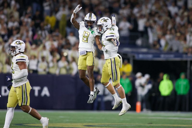 Nov 18, 2023; Atlanta, Georgia, USA; Georgia Tech Yellow Jackets linebacker Kyle Efford (44) celebrates after an interception with wide receiver Malik Rutherford (8) against the Syracuse Orange in the second half at Bobby Dodd Stadium at Hyundai Field. Mandatory Credit: Brett Davis-USA TODAY Sports