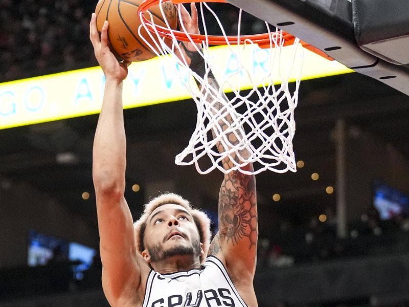 TORONTO, CANADA - MARCH 23: Jeremy Sochan #10 of the San Antonio Spurs goes up for a shot against the Toronto Raptors during the second half at Scotiabank Arena on March 23, 2025 in Toronto, Canada. NOTE TO USER: User expressly acknowledges and agrees that, by downloading and or using this photograph, User is consenting to the terms and conditions of the Getty Images License Agreement. (Photo by Kevin Sousa/Getty Images)