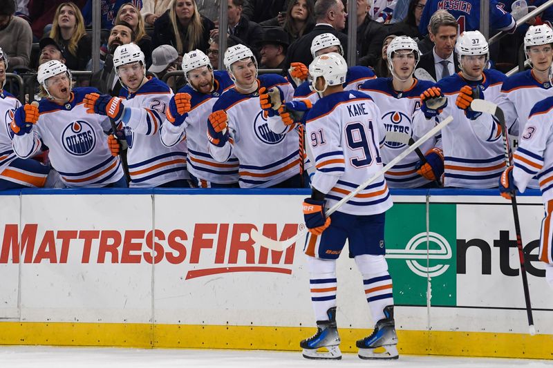 Dec 22, 2023; New York, New York, USA;  Edmonton Oilers left wing Evander Kane (91) celebrates his goal against the New York Rangers during the third period at Madison Square Garden. Mandatory Credit: Dennis Schneidler-USA TODAY Sports