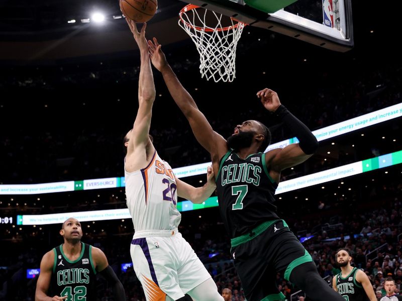 BOSTON, MASSACHUSETTS - FEBRUARY 03: Dario Saric #20 of the Phoenix Suns takes a shot against Jaylen Brown #7 of the Boston Celtics  at TD Garden on February 03, 2023 in Boston, Massachusetts. NOTE TO USER: User expressly acknowledges and agrees that, by downloading and or using this photograph, User is consenting to the terms and conditions of the Getty Images License Agreement. (Photo by Maddie Meyer/Getty Images)