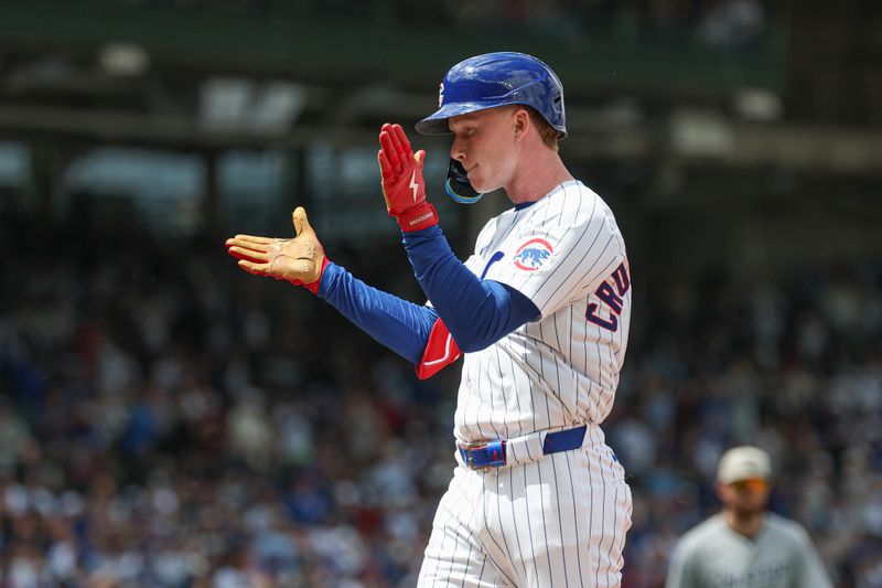 May 17, 2025; Chicago, Illinois, USA; Chicago Cubs right fielder Pete Crow-Armstrong (4) celebrates after hitting a two-run single against the Chicago White Sox during the second inning at Wrigley Field. Mandatory Credit: Kamil Krzaczynski-Imagn Images