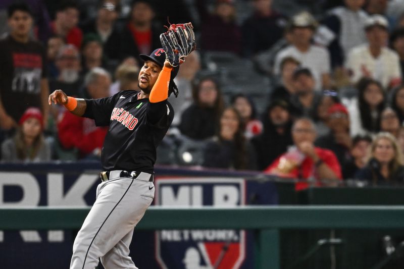 May 25, 2024; Anaheim, California, USA; Cleveland Guardians third baseman José Ramírez (11) makes a catch against the Los Angeles Angels during the sixth inning at Angel Stadium. Mandatory Credit: Jonathan Hui-USA TODAY Sports