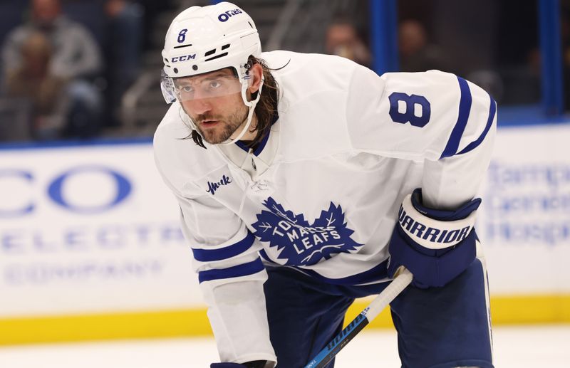 Nov 30, 2024; Tampa, Florida, USA; Toronto Maple Leafs defenseman Chris Tanev (8) against the Tampa Bay Lightning during the third period at Amalie Arena. Mandatory Credit: Kim Klement Neitzel-Imagn Images