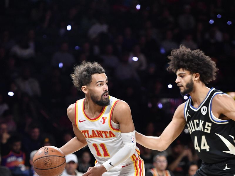 LAS VEGAS, NV - DECEMBER 14: Trae Young #11 of the Atlanta Hawks handles the ball during the game against the Milwaukee Bucks during the Emirates NBA Cup Eastern Semifinals on December 14, 2024 at the T-Mobile Arena in Las Vegas, Nevada. NOTE TO USER: User expressly acknowledges and agrees that, by downloading and or using this photograph, User is consenting to the terms and conditions of the Getty Images License Agreement. Mandatory Copyright Notice: Copyright 2024 NBAE (Photo by Logan Riely/NBAE via Getty Images)