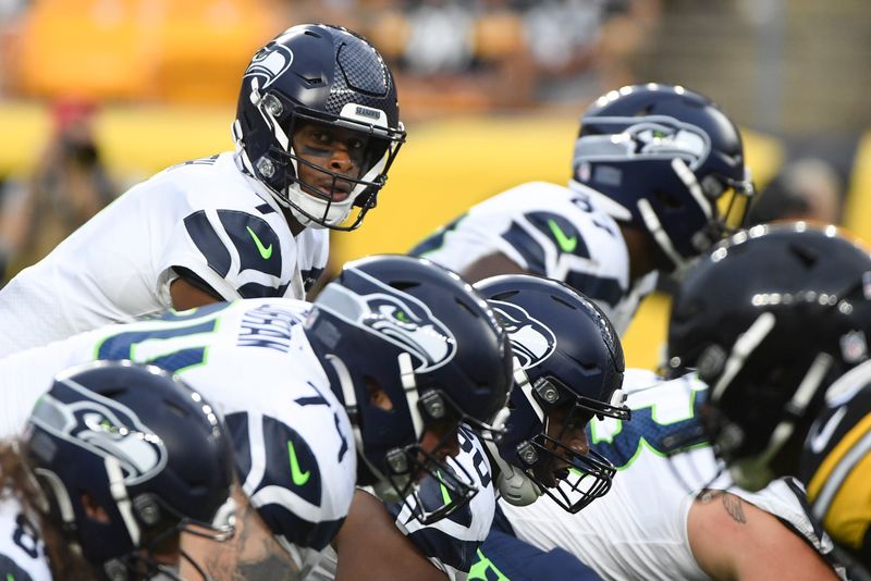 Seattle Seahawks quarterback Geno Smith (7) calls signal at the line of scrimmage against the Pittsburgh Steelers during the first half of an NFL preseason football game, Saturday, Aug. 13, 2022, in Pittsburgh. (AP Photo/Barry Reeger)