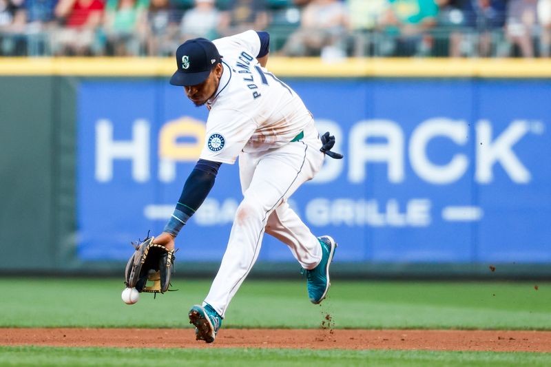 Jul 2, 2024; Seattle, Washington, USA; Seattle Mariners second baseman Jorge Polanco (7) fails to field a ground ball for a single against the Baltimore Orioles during the sixth inning at T-Mobile Park. Mandatory Credit: Joe Nicholson-USA TODAY Sports
