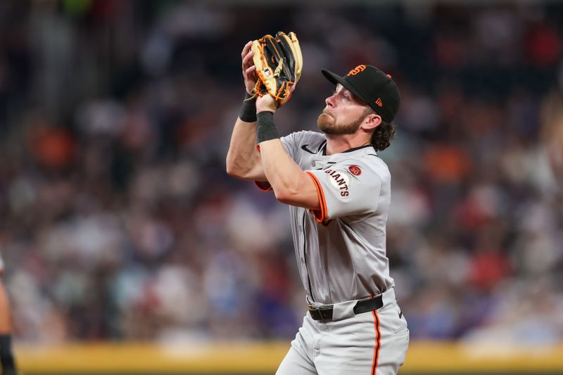 Jul 2, 2024; Atlanta, Georgia, USA; San Francisco Giants second baseman Brett Wisely (0) catches a pop fly against the Atlanta Braves in the sixth inning at Truist Park. Mandatory Credit: Brett Davis-USA TODAY Sports