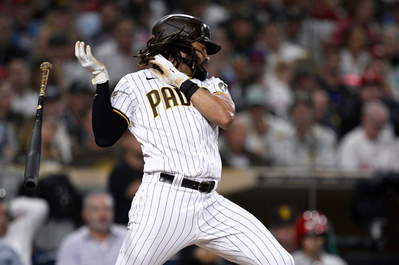 Sep 5, 2023; San Diego, California, USA; San Diego Padres right fielder Fernando Tatis Jr. (23) reacts to an inside pitch during the sixth inning against the Philadelphia Phillies at Petco Park. Mandatory Credit: Orlando Ramirez-USA TODAY Sports