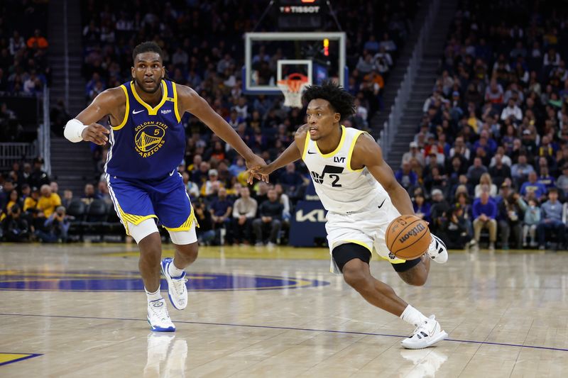 SAN FRANCISCO, CALIFORNIA - JANUARY 28: Collin Sexton #2 of the Utah Jazz drives to the basket against Kevon Looney #5 of the Golden State Warriors in the fourth quarter at Chase Center on January 28, 2025 in San Francisco, California. NOTE TO USER: User expressly acknowledges and agrees that, by downloading and or using this photograph, User is consenting to the terms and conditions of the Getty Images License Agreement. (Photo by Lachlan Cunningham/Getty Images)