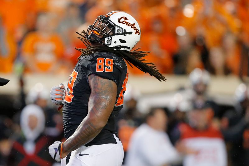 Sep 10, 2022; Stillwater, Oklahoma, USA; Oklahoma State Cowboys defensive end Tyler Lacy (89) celebrates after a sack during a college football game against the Arizona State Sun Devils at Boone Pickens Stadium.  Oklahoma State won 34-17. Mandatory Credit: Bryan Terry-USA TODAY Sports