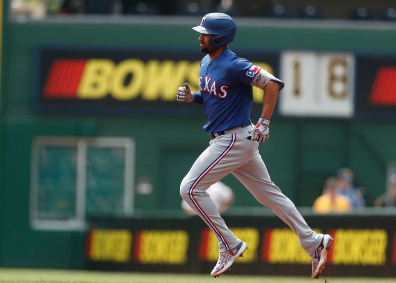 May 24, 2023; Pittsburgh, Pennsylvania, USA; Texas Rangers second baseman Marcus Semien (2) circles the base on a solo home run against the Pittsburgh Pirates during the first inning at PNC Park. Mandatory Credit: Charles LeClaire-USA TODAY Sports