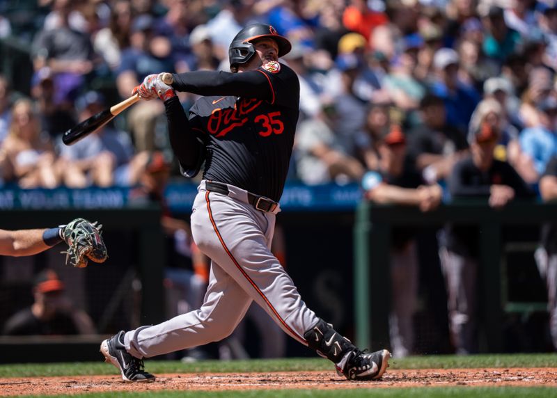 Jun 5, 2025; Seattle, Washington, USA;  Balitimore Orioles designated hitter Adley Rutschman (35) hits a two-run home run during the sixth inning against the Seattle Mariners at T-Mobile Park. Mandatory Credit: Stephen Brashear-Imagn Images