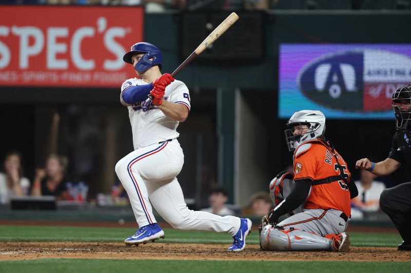 Jul 20, 2024; Arlington, Texas, USA; Texas Rangers left fielder Wyatt Langford (36) doubles in a run against the Baltimore Orioles in the eighth inning at Globe Life Field. Mandatory Credit: Tim Heitman-USA TODAY Sports